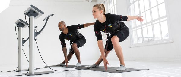 Two professionals exercising in Surge's purpose-built EMS studios