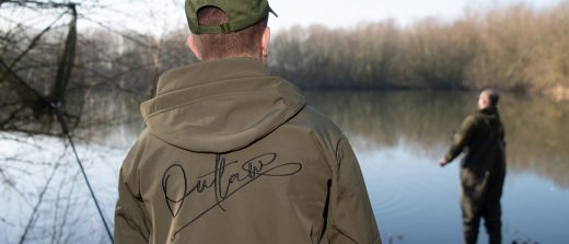 A fisherman standing by Outlaw Pro's lake in Essex near their new megastore.
